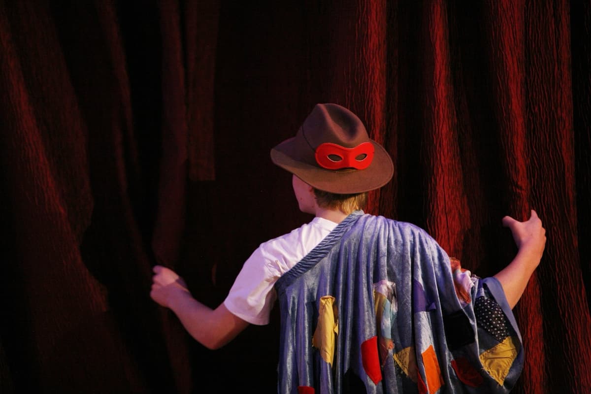 Theatre performance with dramatic lighting